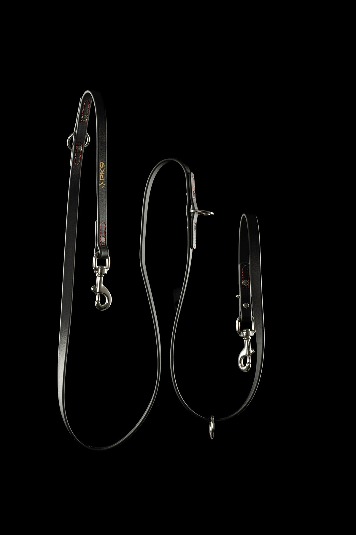 A black leather dog leash with silver metal clips and red stitching